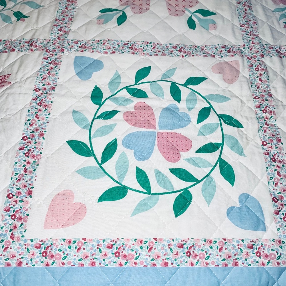Pristine 60” x 80” hearts and flowers quilt